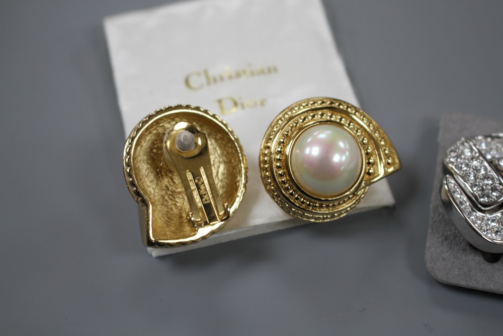 Two pairs of Christian Dior costume ear clips, white paste and simulated pearl, both approx. 33mm, both in Dior boxes.